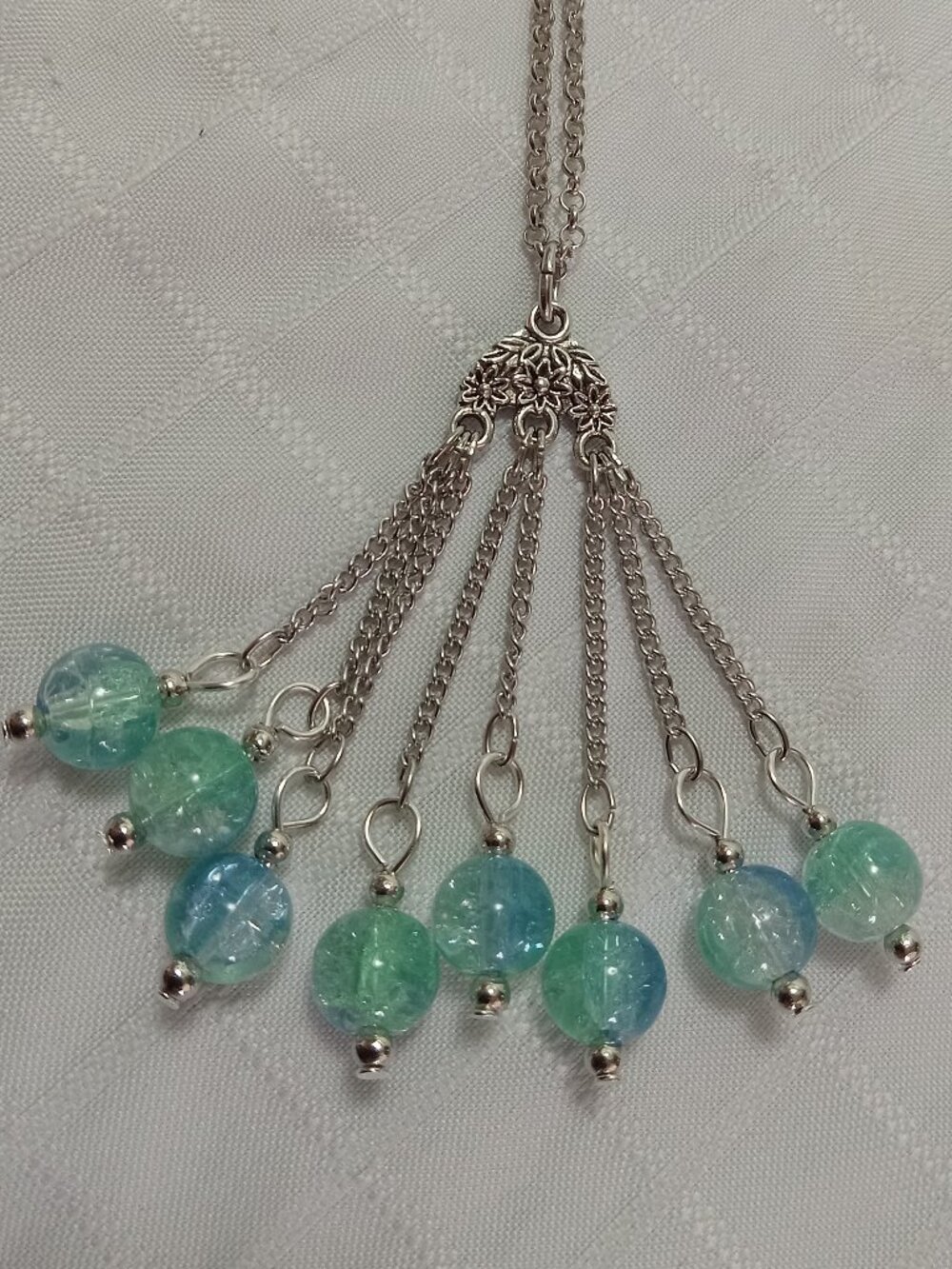 Exquisite handmade necklace featuring a half-moon-shaped Tibetan silver charm